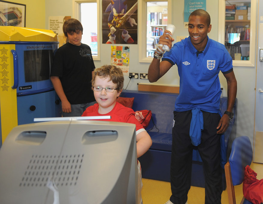 Ashley Young tries his hand at the Wii.